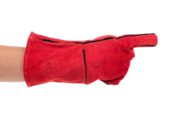 Heavy-duty red glove on the hand. Isolated on a white background. Close-up.